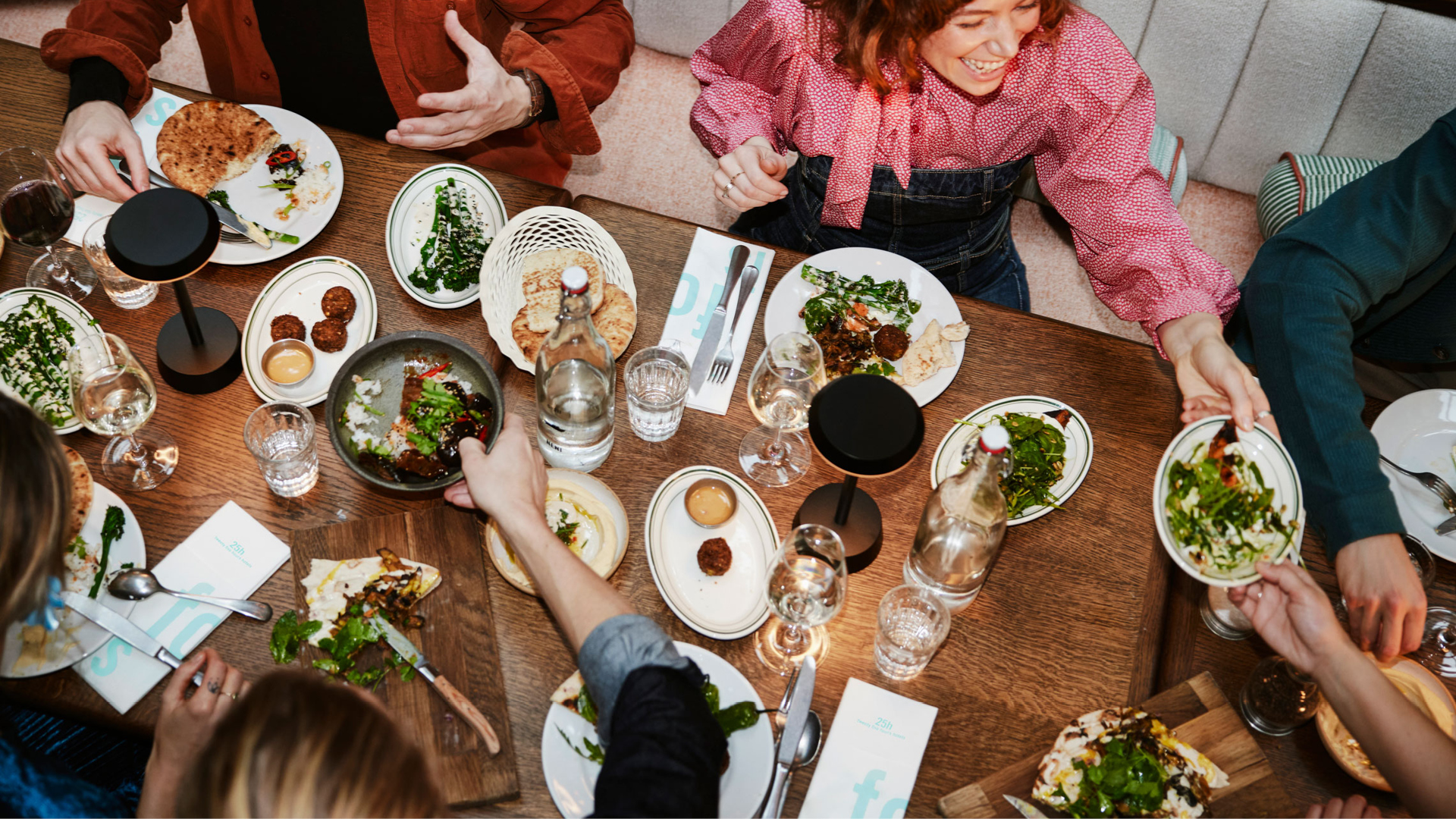 People enjoying a dinner with customised napkins People enjoying a dinner with customised napkins