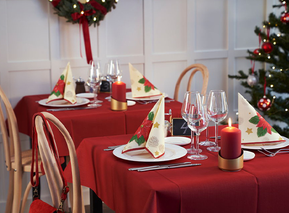 Festive red Christmas table cover with decorative napkins