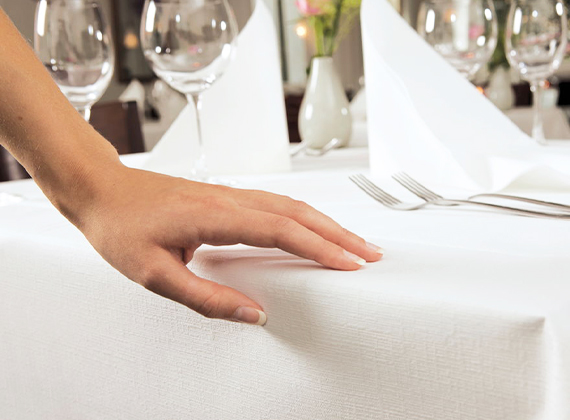 Linen-feel disposable table cover on a restaurant table